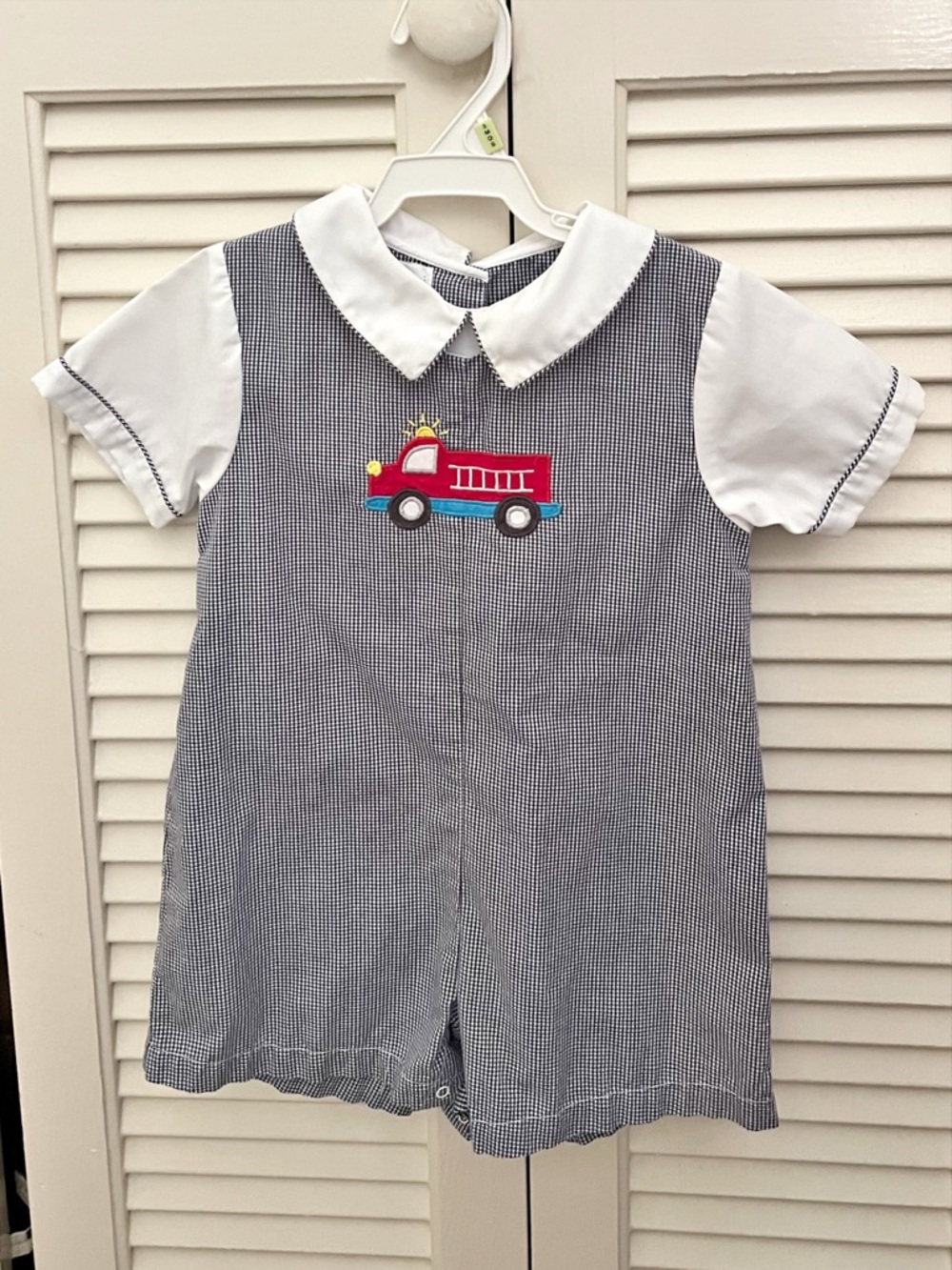Petit Ami Navy Gingham Romper with Red Sun Applique